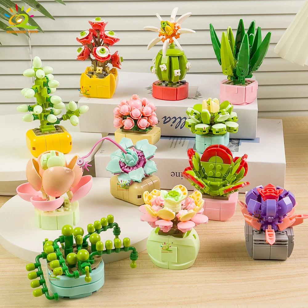 A collection of colorful succulent and flower building blocks in various shades of green, pink, yellow, and red arranged on a