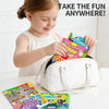 A young girl is using a reusable sticker book for a quiet activity, showing colorful stickers and pages.