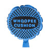 A blue Whoopee Cushion with a black and blue checkered pattern and the text WHOOPEE CUSHION.