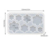 A white silicone mold set with various geometric shapes for making epoxy resin earrings and pendants.