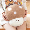 A light brown mushroom plush toy with white polka dots is held by a person wearing a cream-colored sweater.