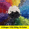 A collection of 16 colored building blocks in various shapes and sizes.