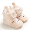 Pair of light pink animal-themed baby first walker shoes with soft faux fur trim