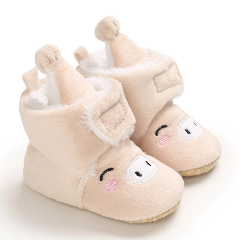 Pair of light pink animal-themed baby first walker shoes with soft faux fur trim