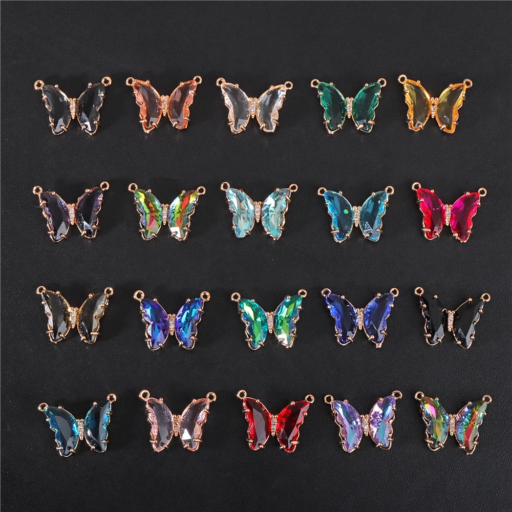 A collection of crystal butterfly charm beads in various colors and finishes for jewelry making.