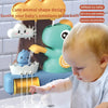 A baby is playing with a cute animal shape design dinosaur bath toy sprinkler that sprays water.