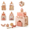A set of wooden rocket stacking toys and shape sorters in pink and natural wood colors.