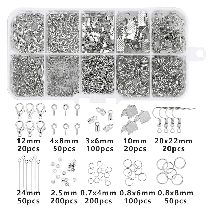 A collection of silver jewelry making supplies including various beads wire tools and findings organized in compartments.