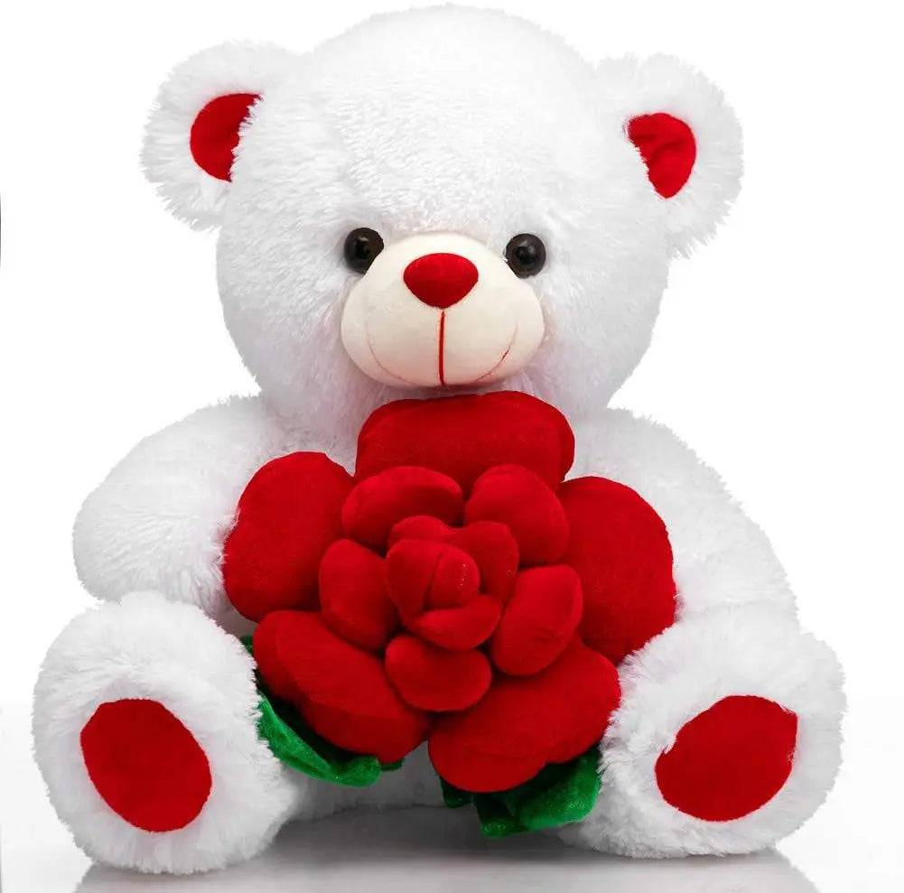 A white plush bear with red accents holding a large red rose.