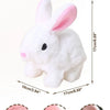 White plush rabbit toy with pink ears, soft round eyes, furry tail, and floppy ears.