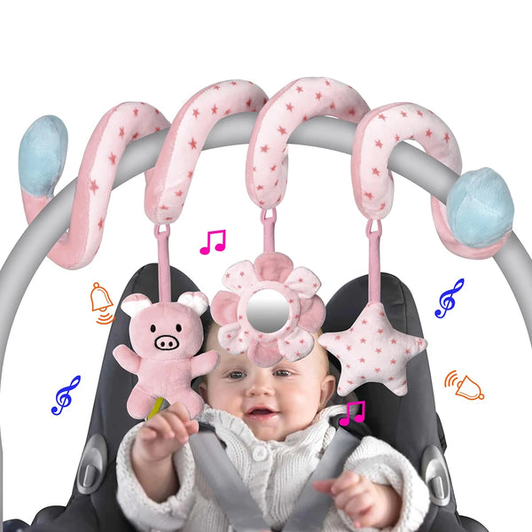 A baby is interacting with multi-functional hanging toys featuring pink and blue elements.