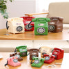 A collection of vintage rotary telephone piggy banks in various colors, including pink, red, green, and brown, displayed on a