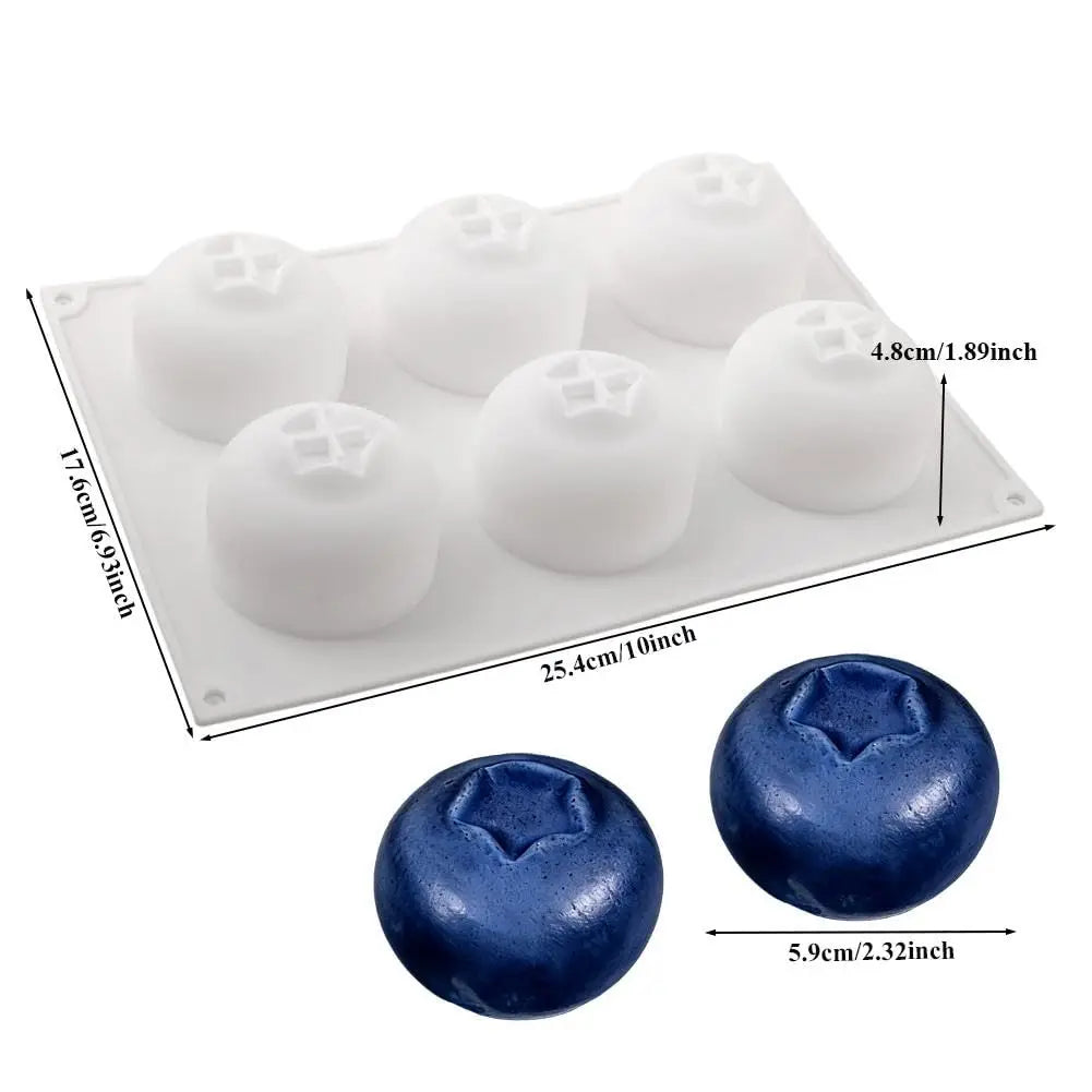 White silicone fruit molds for baking and desserts shown alongside a blue spherical mold