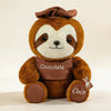 A brown sloth plush toy with a brown hat and a chocolate-colored chest, sitting on a white background.