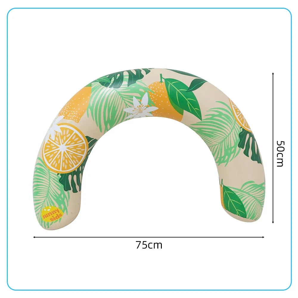 A beige inflatable U-shaped swim ring with a tropical leaf and citrus pattern, designed for neck and back support.