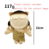 A light tan collectible plush doll resembling a person with gold glitter fabric on the chest.