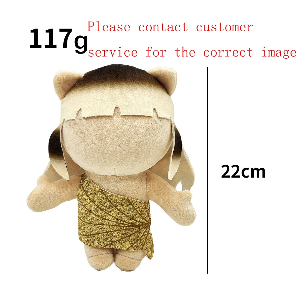 A light tan collectible plush doll resembling a person with gold glitter fabric on the chest.