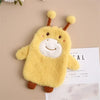 A yellow plush-covered hot water bottle with floppy ears resting on a light brown surface.