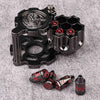 A set of revolver-shaped metal dice for RPG games, featuring various numbered dice and a metal holder.