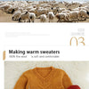 A knitted mustard yellow sweater made from fine wool yarn is displayed on a white fluffy surface.