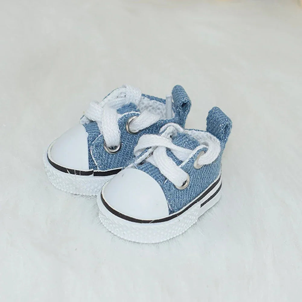 A pair of light blue casual sneakers with white laces and soles resting on a white surface.