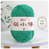 A ball of bright green chenille yarn with Chinese characters for knitting and crochet
