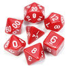 A collection of red acrylic dice, including a d20 and various numbered dice, scattered on a white surface.