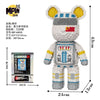 A small bear figure made of micro building blocks with yellow ears and a white body, packaged for sale.