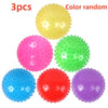 A set of three colorful inflatable sensory balls for kids, including yellow, pink, green, red, and purple.