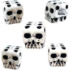 A set of mini white skull dice used for Halloween and party games.