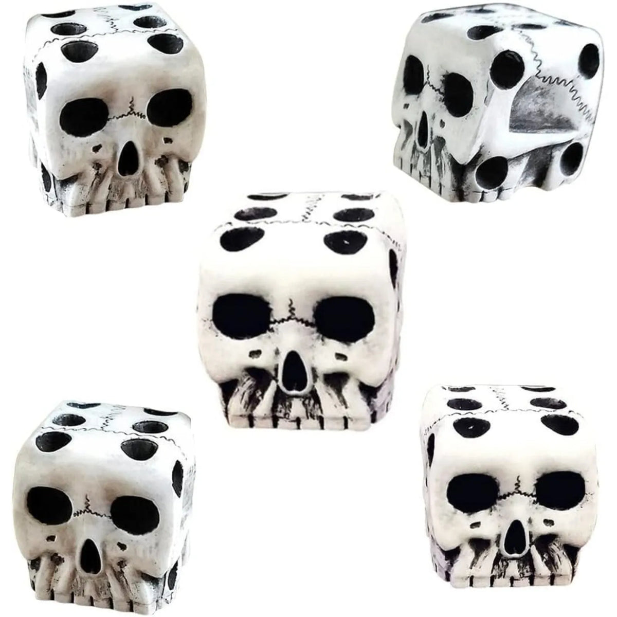 A set of mini white skull dice used for Halloween and party games.