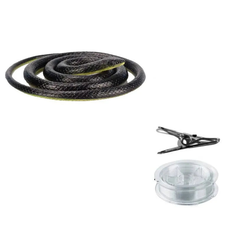 A coiled black snake toy with a string and a metal clip.