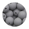 A close-up view of many gray silicone round beads for jewelry making.