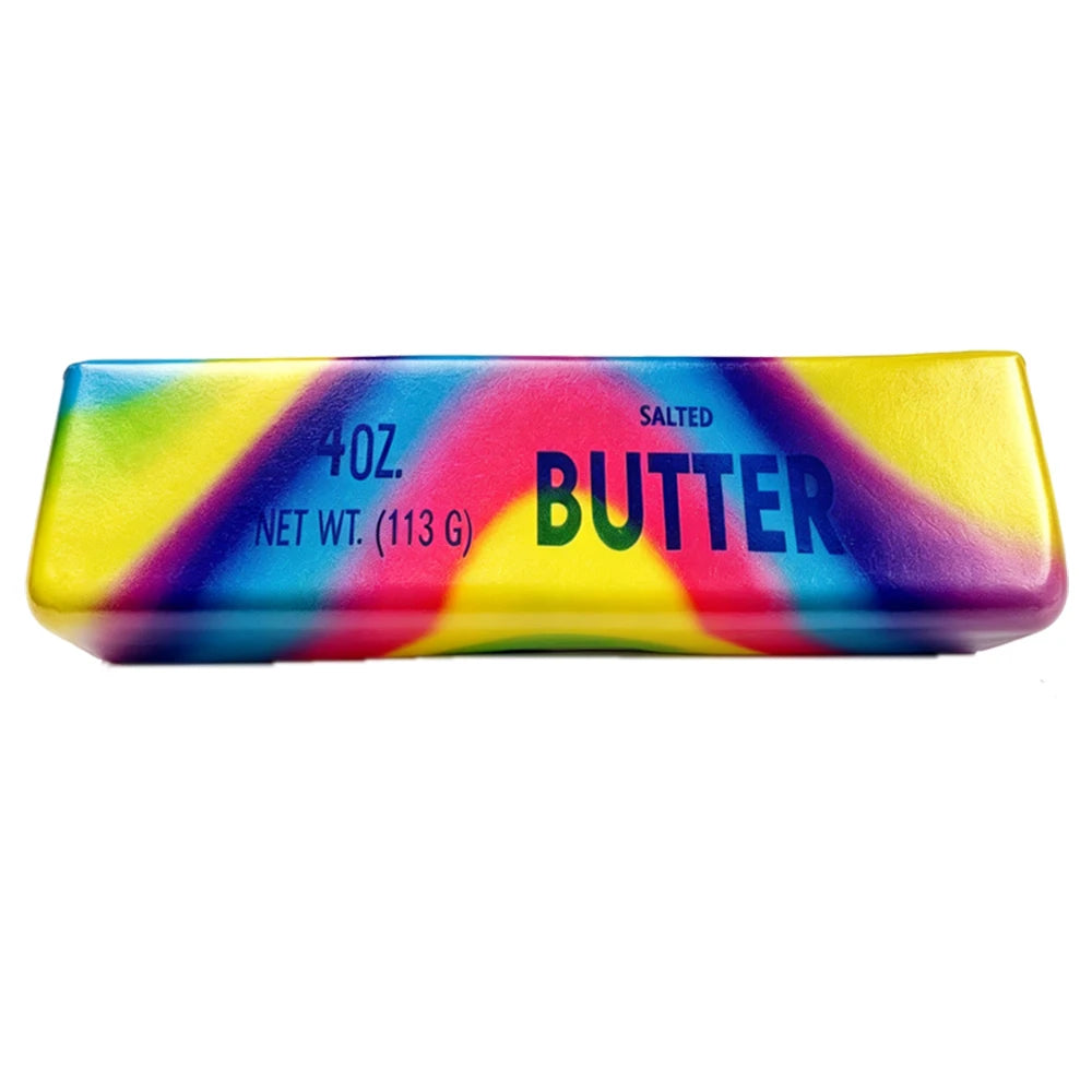 A rectangular, brightly colored salted butter stick squishy toy with rainbow stripes and the word BUTTER printed on it.