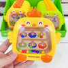 A yellow magnetic bead puzzle board for toddlers with numbered holes and colored beads, held in a hand.