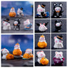 A collection of charming cartoon bear and pumpkin figurines in various colors and styles for Halloween or fairy garden displa