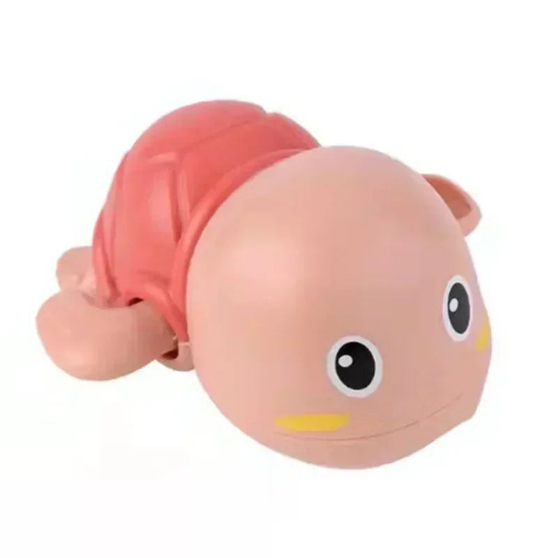 A pink wind-up swimming duck bath toy for toddlers with a pink shell and yellow accents.