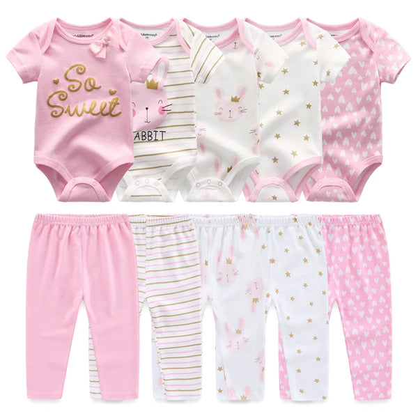 A set of pink and white newborn bodysuits and pants for a baby