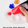 A hand applies bright red acrylic paint to a white plate, demonstrating the thick, glossy texture of the color powder.