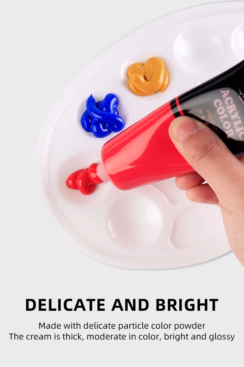 A hand applies bright red acrylic paint to a white plate, demonstrating the thick, glossy texture of the color powder.