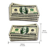 A stack of US one hundred dollar bills shown next to a measurement ruler.