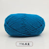 A ball of bright blue pre-dyed milk cotton yarn used for knitting and crochet.
