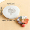 A white silicone mold shaped like a flower, used for decorating fondant, cake, and chocolate.