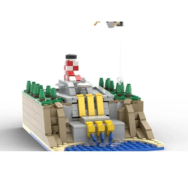 Un kit de construction LEGO représentant un paysage rocheux avec une tour et divers reliefs.