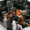 A detailed miniature diorama of a haunted house scene featuring spooky props, bats, and graveyard elements.
