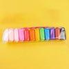 A collection of colorful, stretchy air dry clay modeling kits in various shades are displayed against a yellow background.
