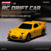 A yellow 1:43 scale RC drift car is shown on a dark surface with a grid background.