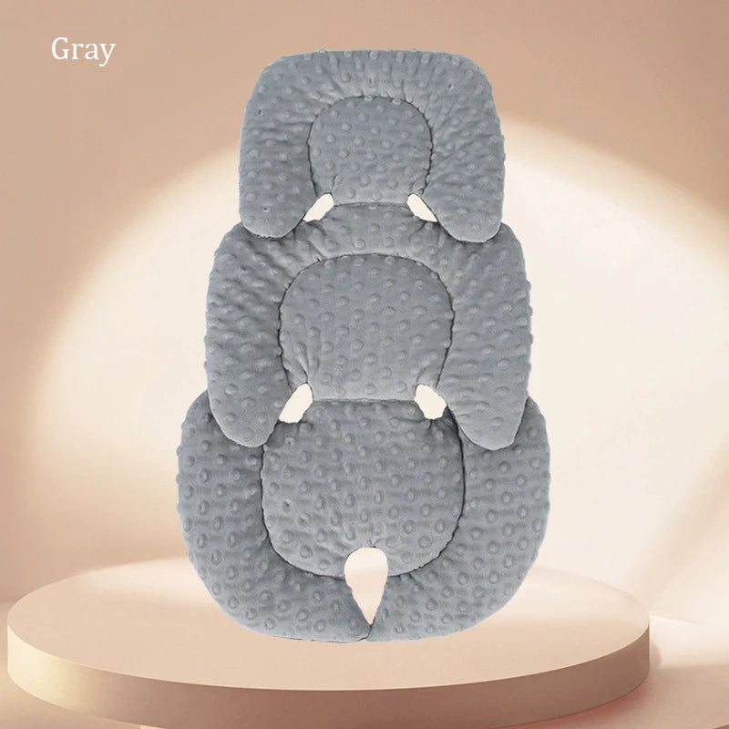A gray plush double-sided stroller seat cushion is shown against a light background.