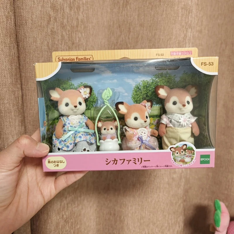 A boxed set of Sylvanian Families featuring a deer family figure, including several small animal figures.