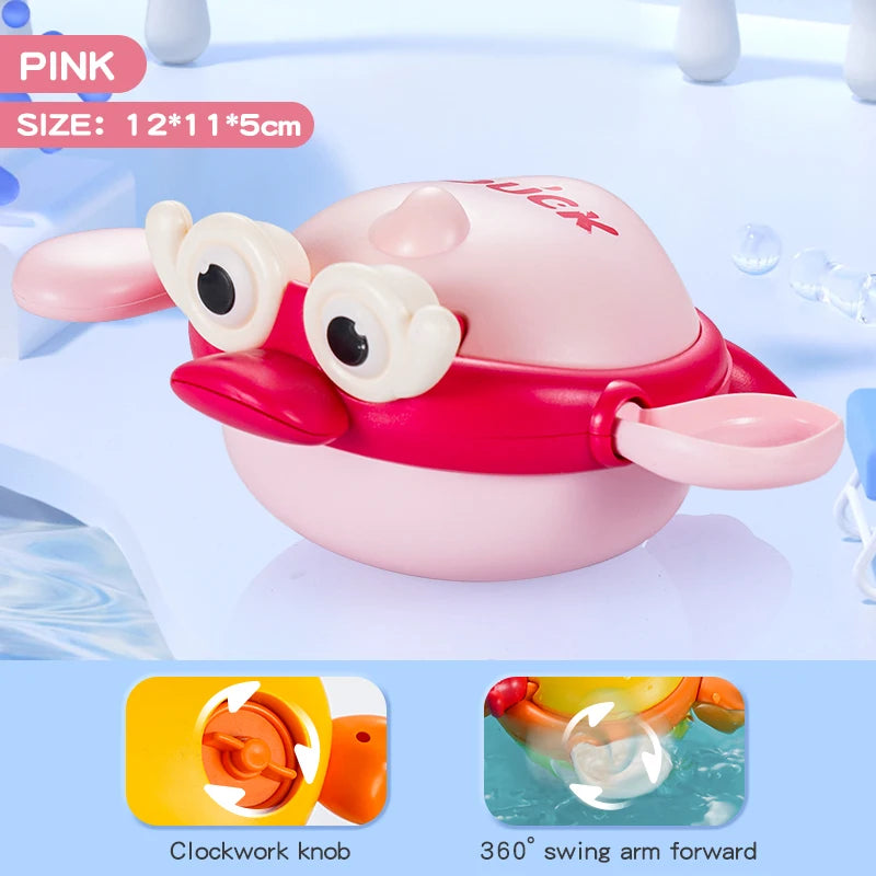 Pink wind-up swimming bath toy featuring a duck with a clockwork knob and a 360 degree swing arm.